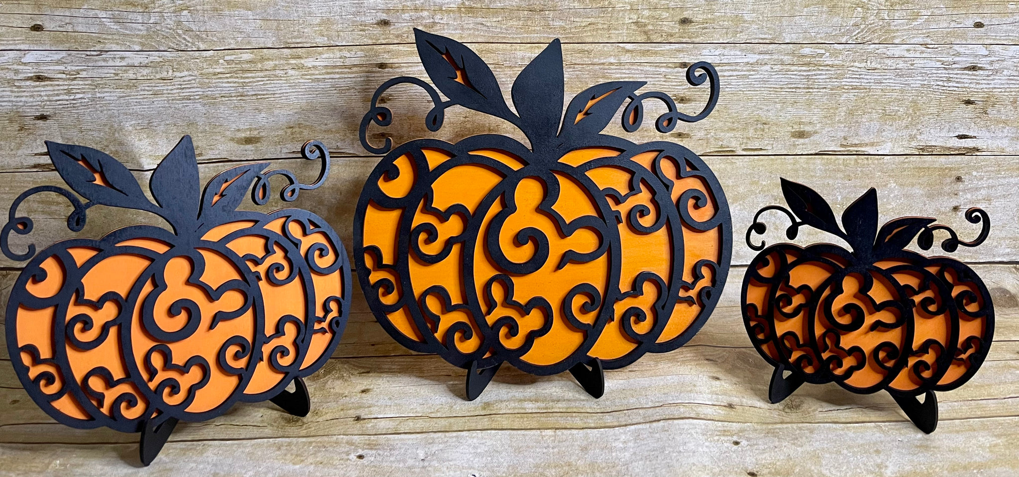 Wooden pumpkin trio