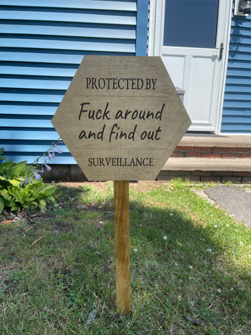 Wooden surveillance sign